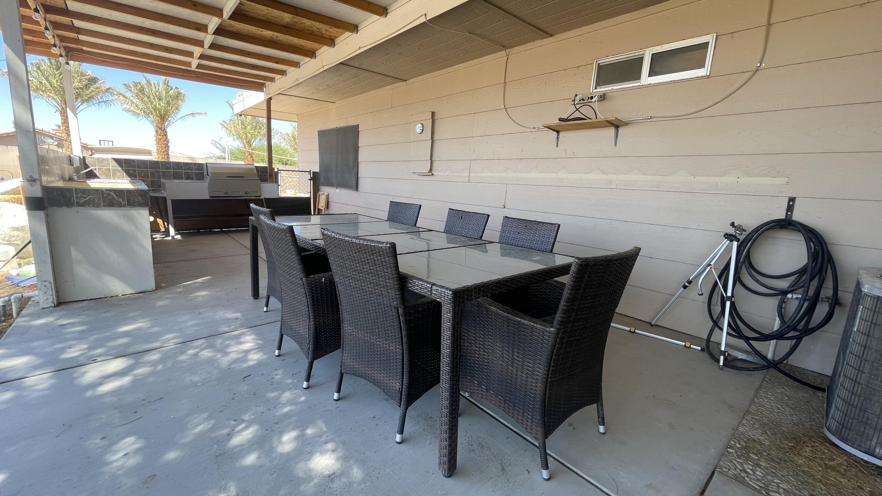 1498 Nile Drive Thermal, CA 92274 - Photo 89 of 108 a dining room with furniture and window
