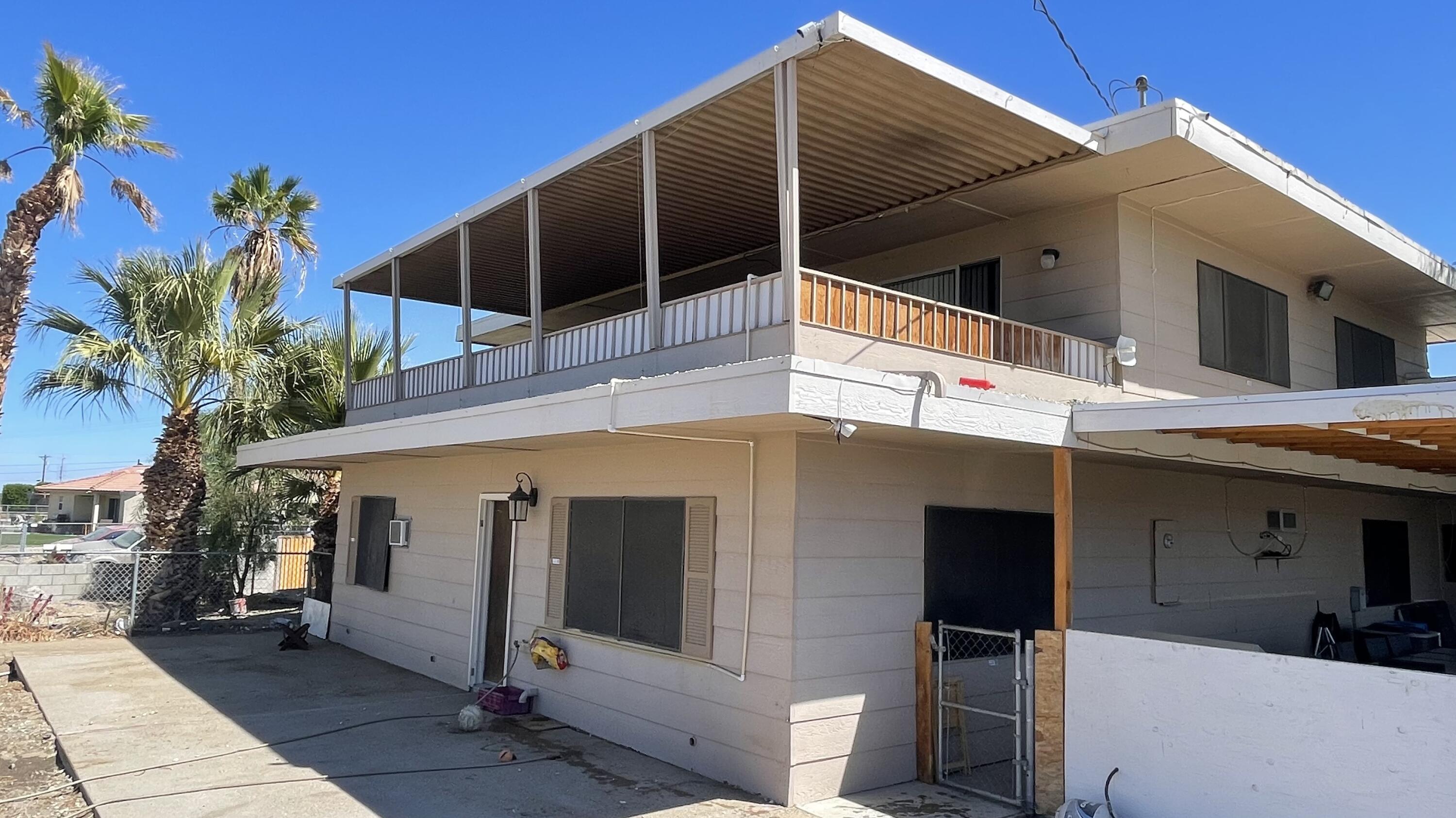 1498 Nile Drive Thermal, CA 92274 - Photo 91 of 108 a front view of a house with a garage