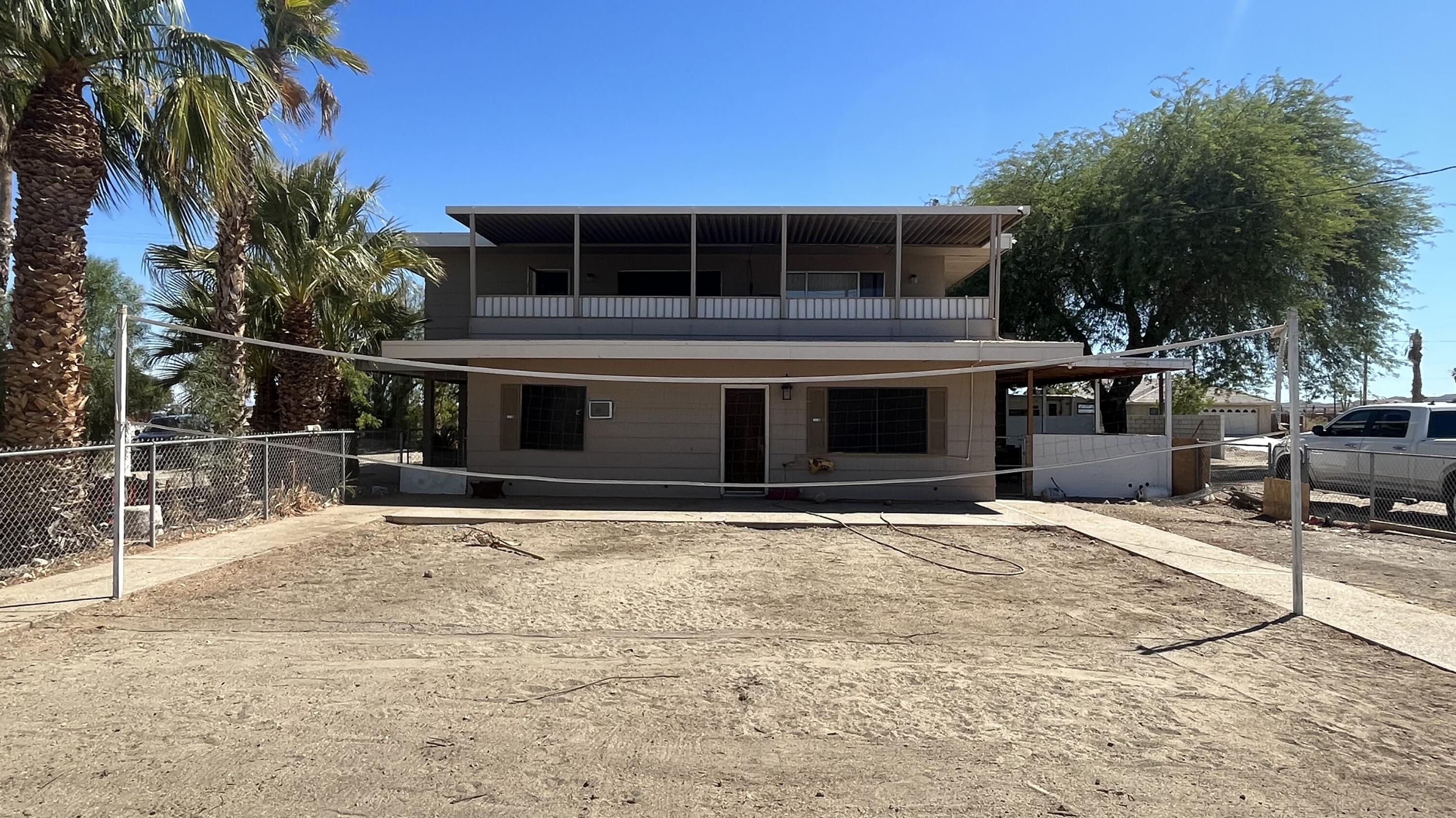 1498 Nile Drive Thermal, CA 92274 - Photo 93 of 108 a front view of a house with a yard