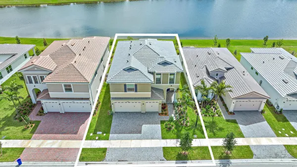 a aerial view of a house with a yard