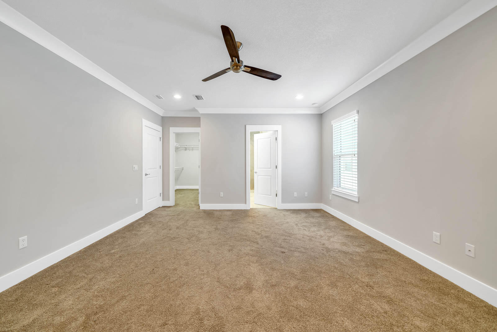 995 Airport Road, Unit 39 Destin, FL 32541 - Photo 16 of 37 a view of an empty room with a ceiling fan
