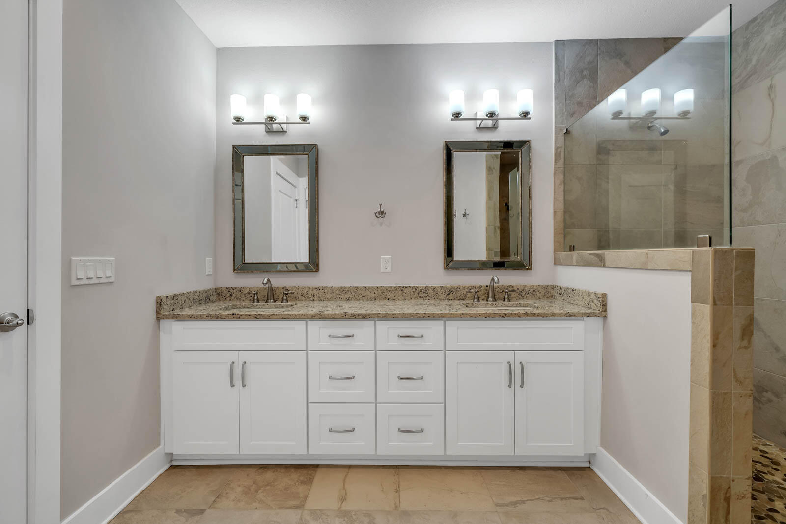 995 Airport Road, Unit 39 Destin, FL 32541 - Photo 17 of 37 a bathroom with a granite countertop double vanity sink and a mirror