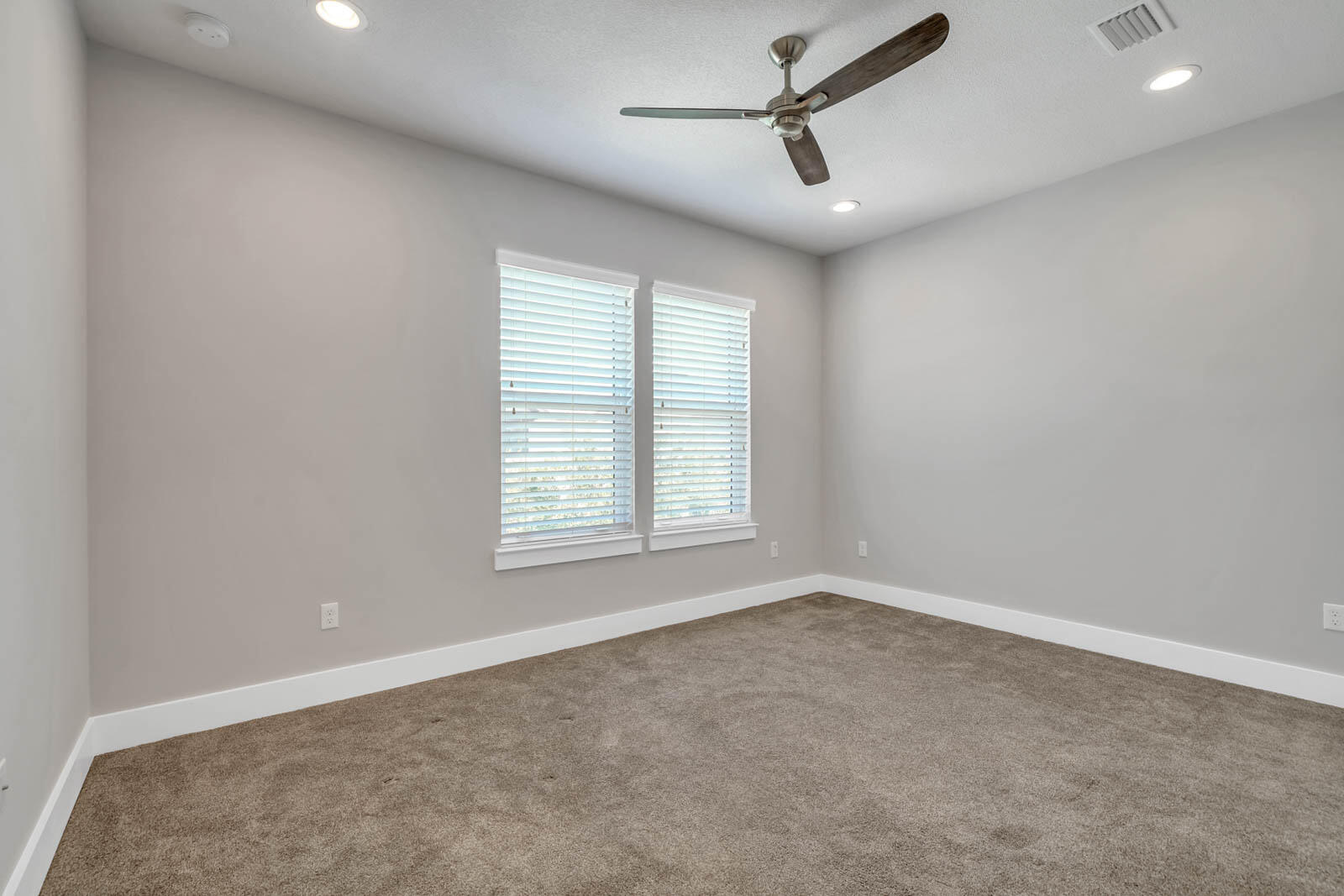 995 Airport Road, Unit 39 Destin, FL 32541 - Photo 21 of 37 a view of a livingroom with a ceiling fan and window
