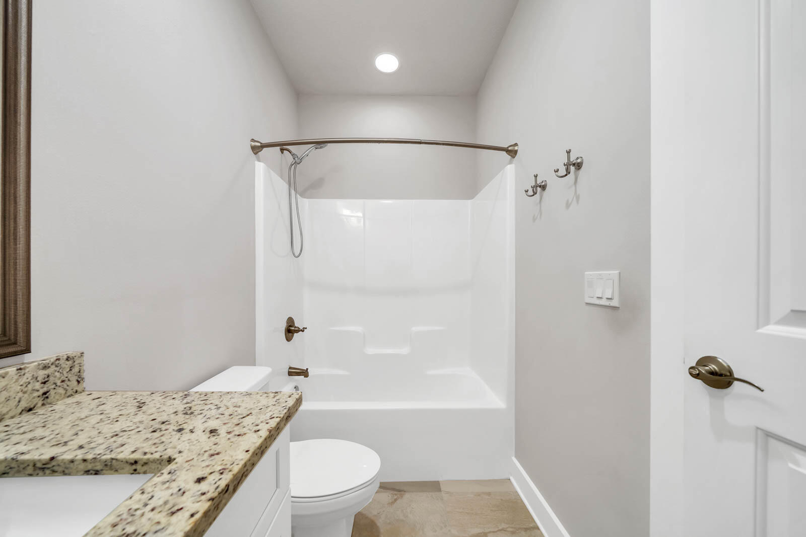 995 Airport Road, Unit 39 Destin, FL 32541 - Photo 25 of 37 a bathroom with a granite countertop sink toilet and shower