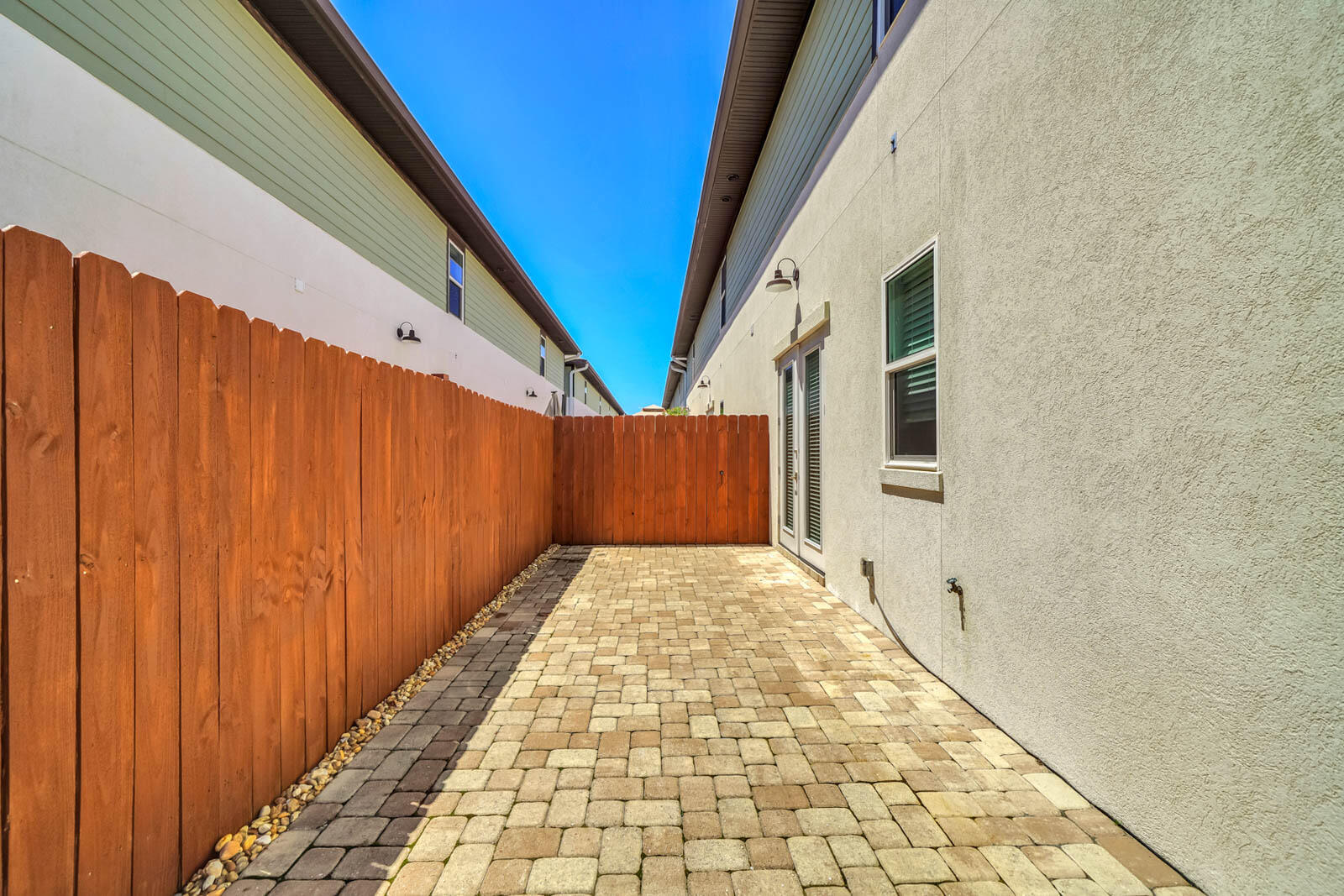 995 Airport Road, Unit 39 Destin, FL 32541 - Photo 33 of 37 a view of a pathway gate with wooden walls