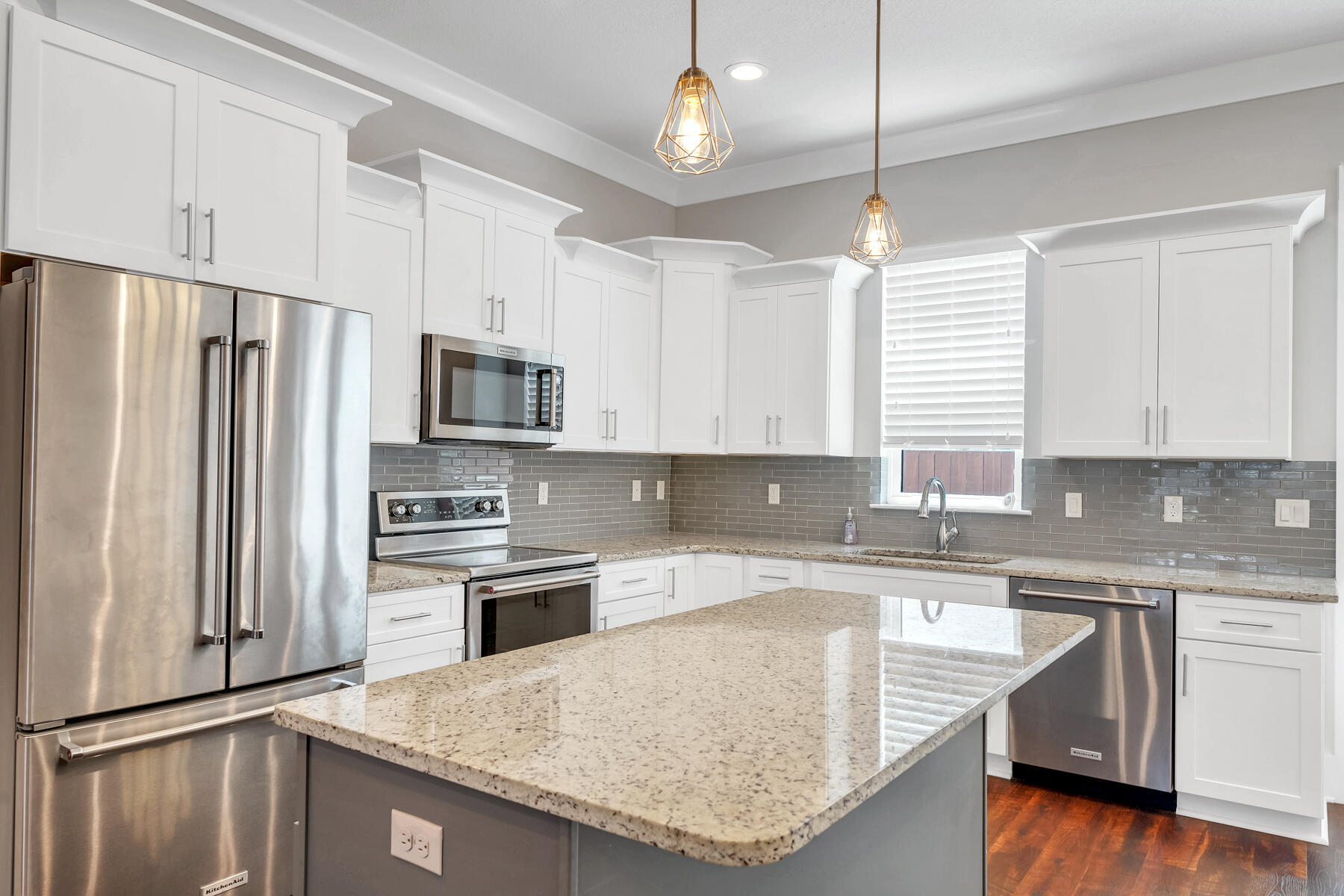 995 Airport Road, Unit 39 Destin, FL 32541 - Photo 6 of 37 a kitchen with stainless steel appliances granite countertop a sink stove and refrigerator
