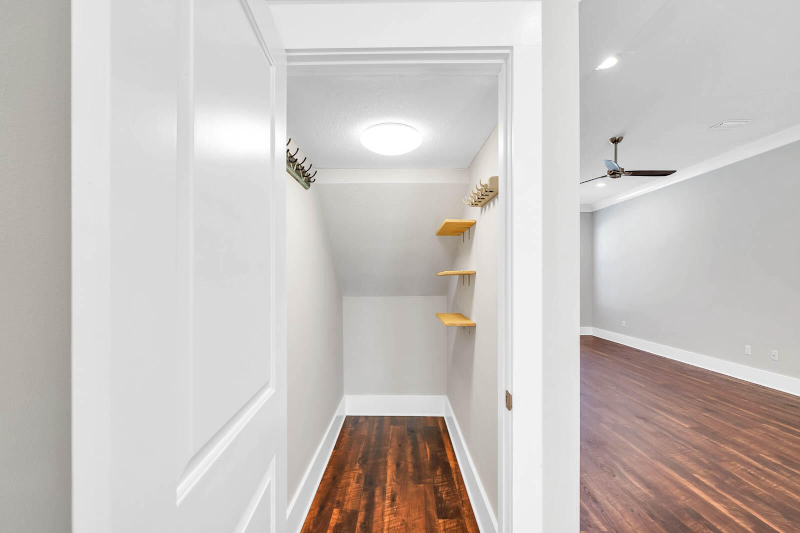 995 Airport Road, Unit 39 Destin, FL 32541 - Photo 10 of 37 a view of a hallway view with wooden floor