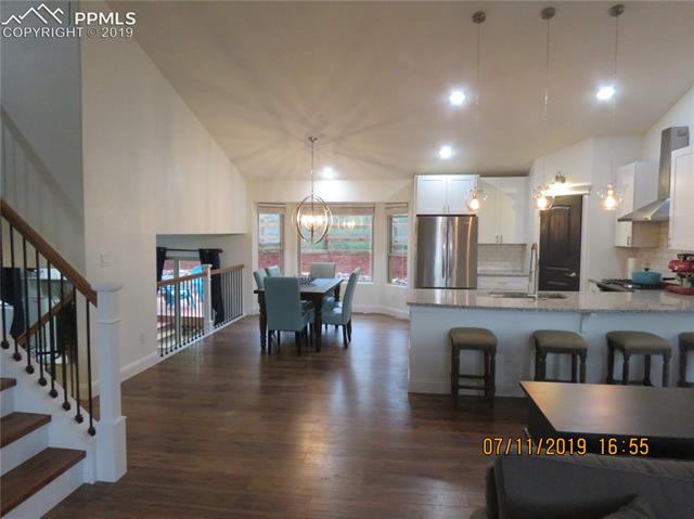 7799 Julynn Road Colorado Springs, CO 80919 - Photo 20 of 27 Another shot of the kitchen in case you didn't catch the vastness of the great room.