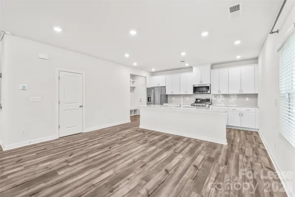 a view of kitchen with wooden floor
