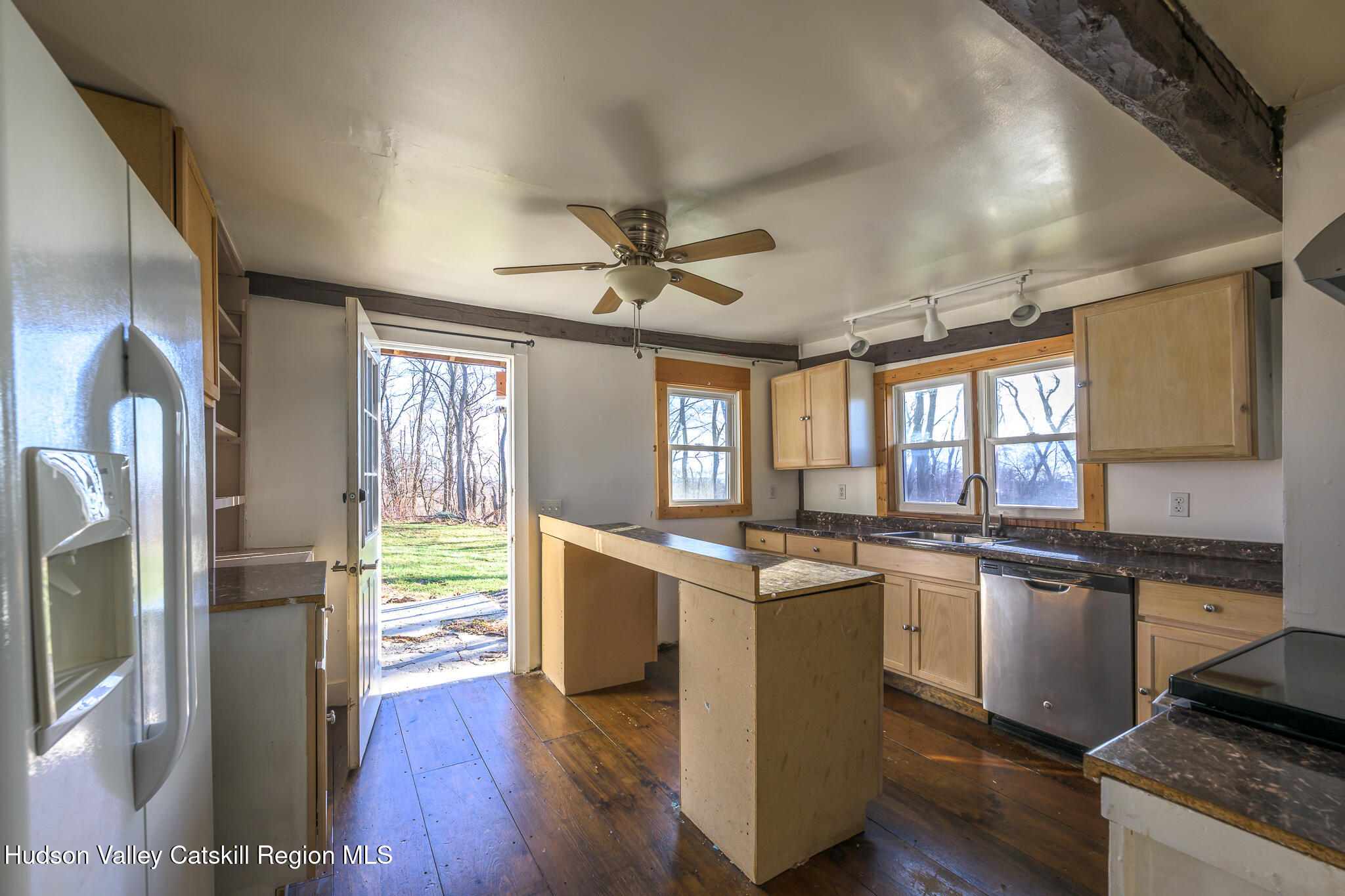 91 Scheller Park Road New Baltimore, NY 12192 - Photo 15 of 26 a kitchen with stainless steel appliances granite countertop hardwood floor sink stove and wooden cabinets