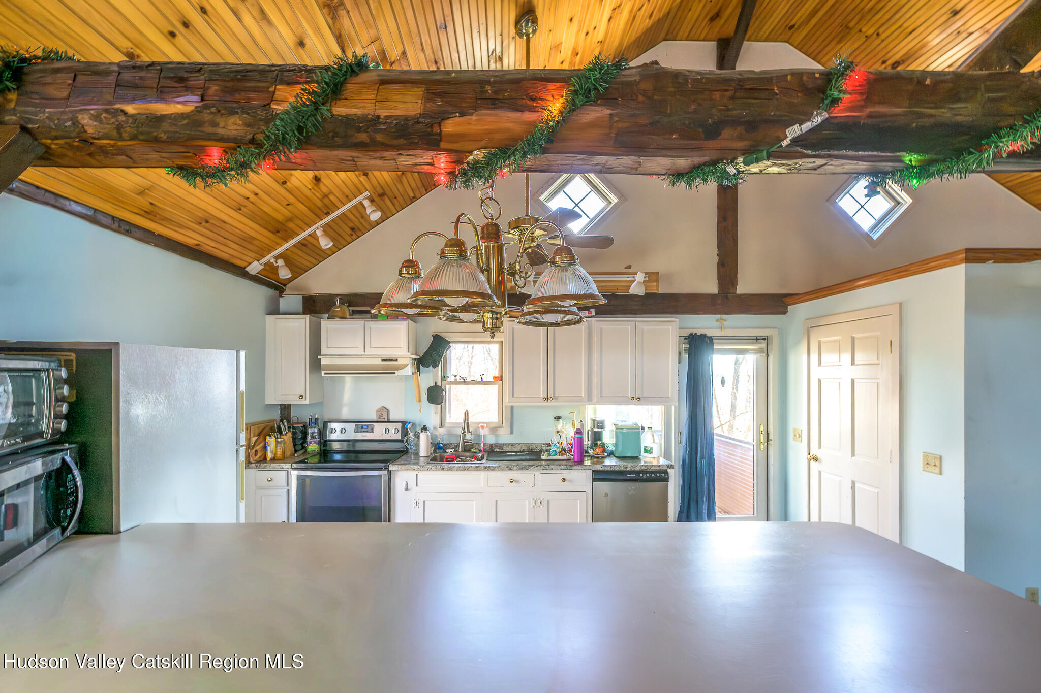 91 Scheller Park Road New Baltimore, NY 12192 - Photo 20 of 26 a view of a living room and chandelier