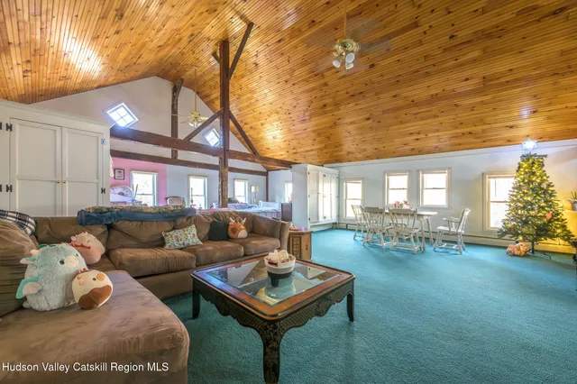 a living room with furniture and a table