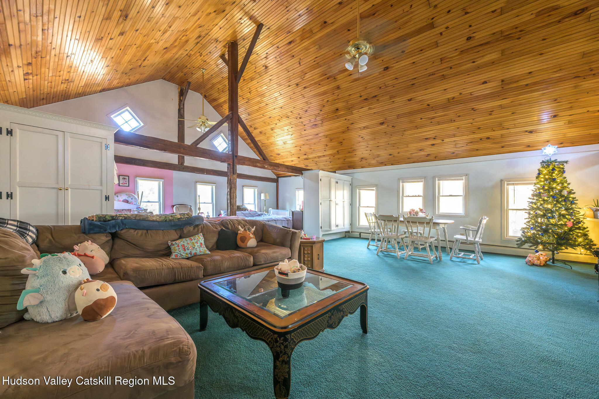 91 Scheller Park Road New Baltimore, NY 12192 - Photo 21 of 26 a living room with furniture and a table