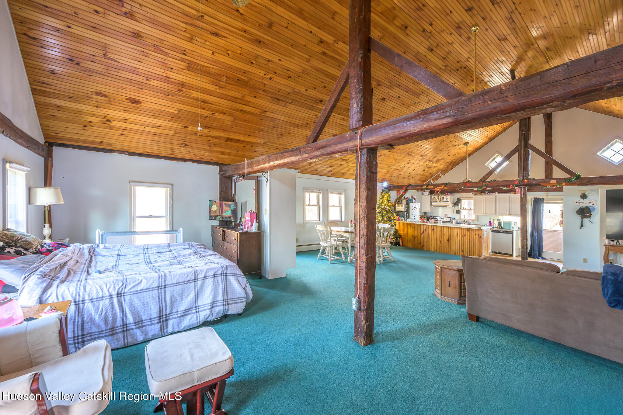 91 Scheller Park Road New Baltimore, NY 12192 - Photo 22 of 26 a bedroom with furniture and a large window