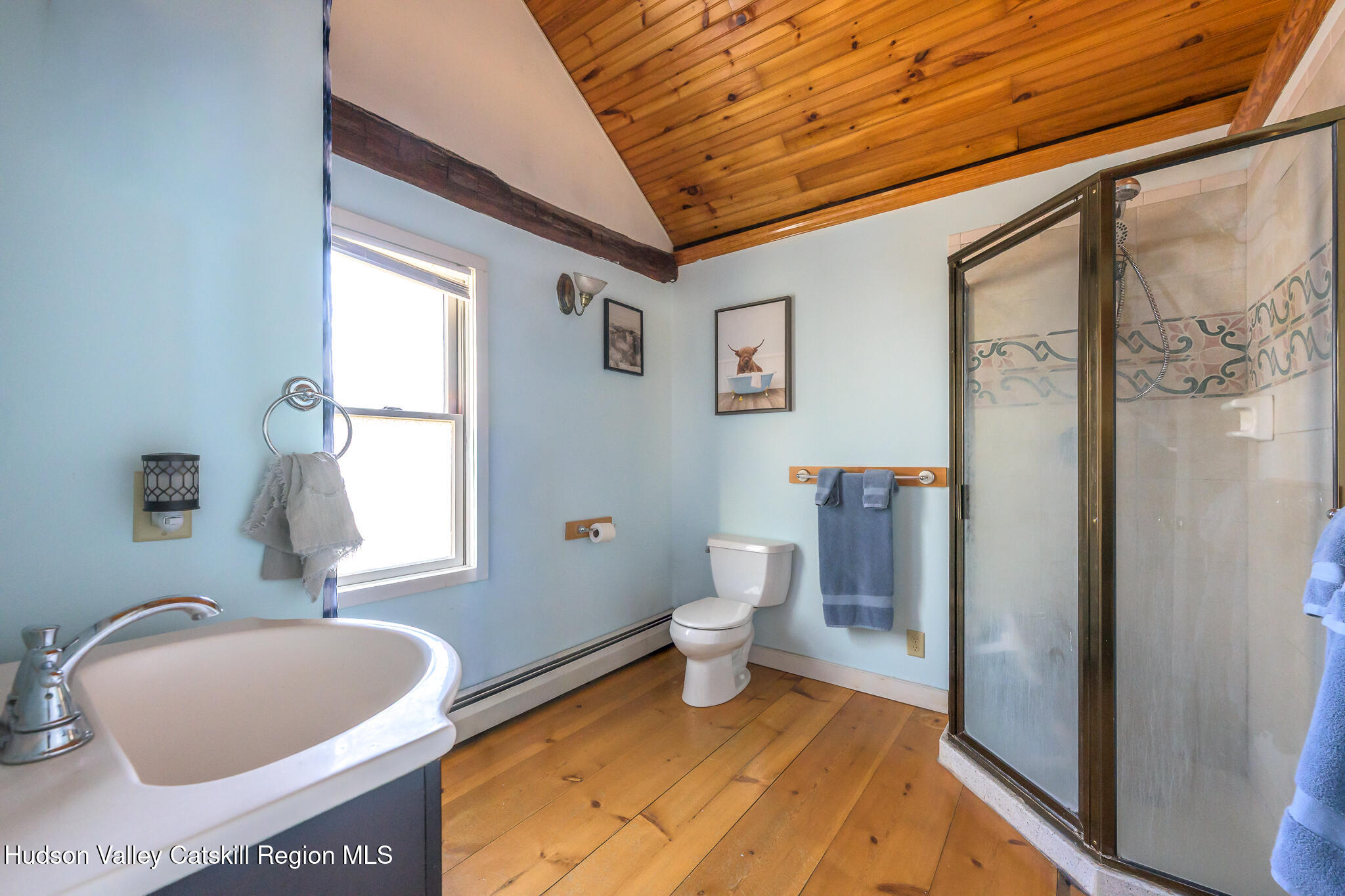 91 Scheller Park Road New Baltimore, NY 12192 - Photo 23 of 26 a bathroom with a toilet sink and bathtub