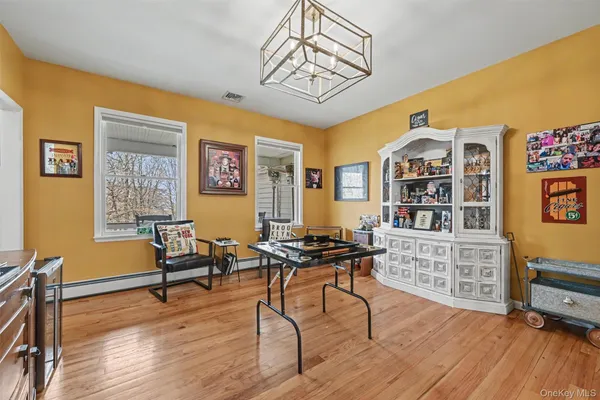 a workspace with furniture window and wooden floor