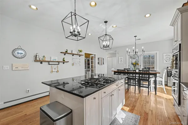 a kitchen with a table and chairs in it