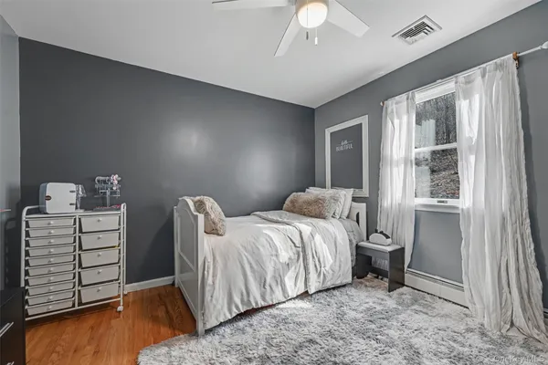 a bed room with a bed and a window