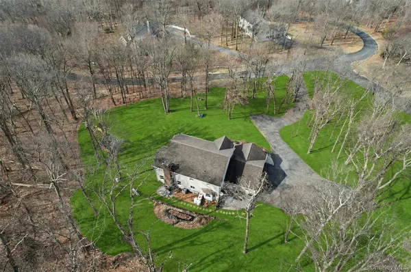 a view of a backyard with sitting area