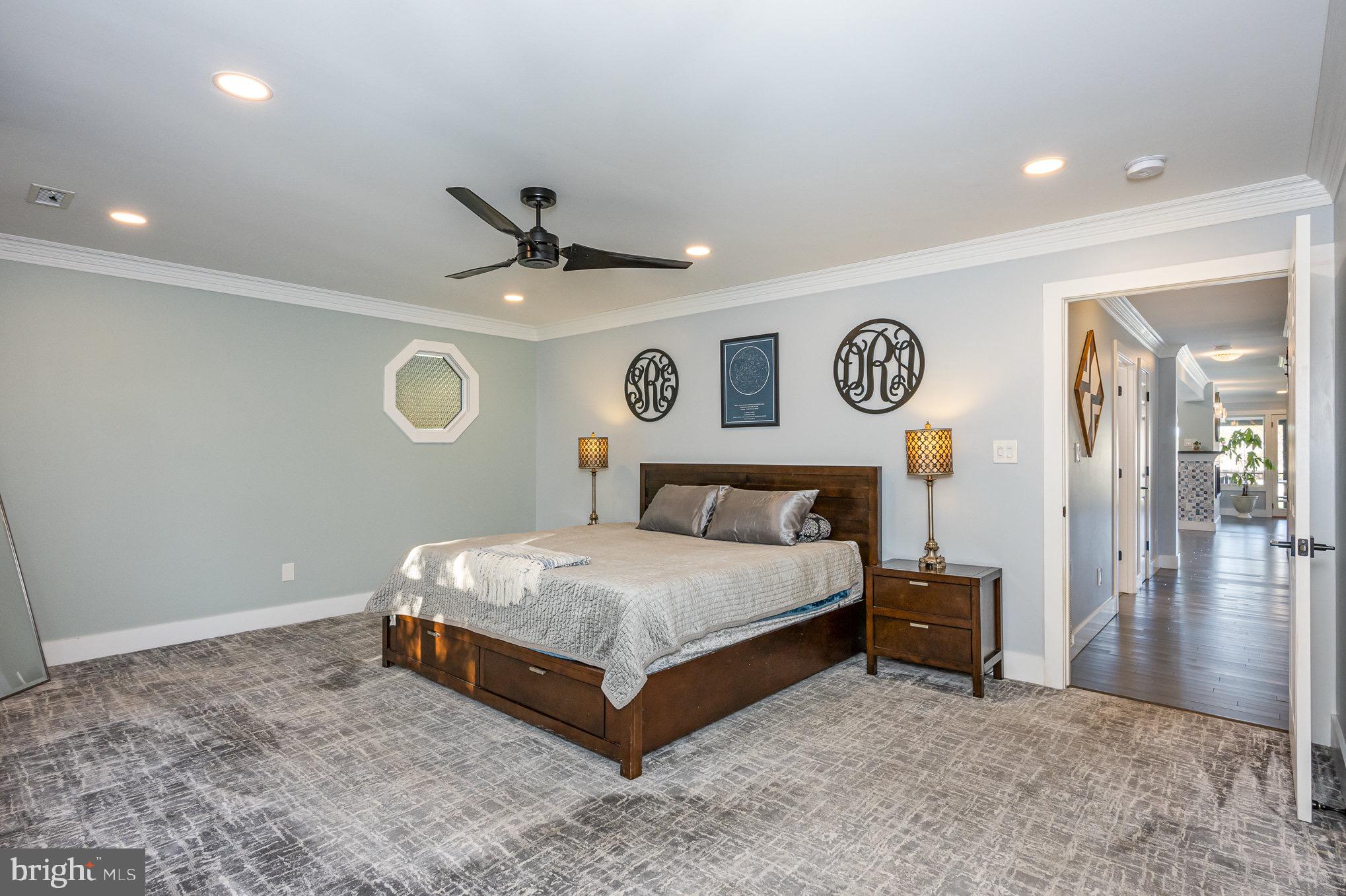 1102 Burke Road Middle River, MD 21220 - Photo 19 of 84 a bedroom with a bed and a chandelier