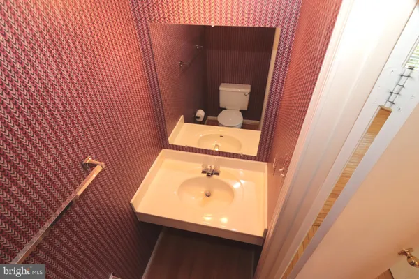 a bathroom with a sink and mirror