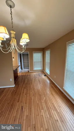 a view of a livingroom with a dishwasher and furniture