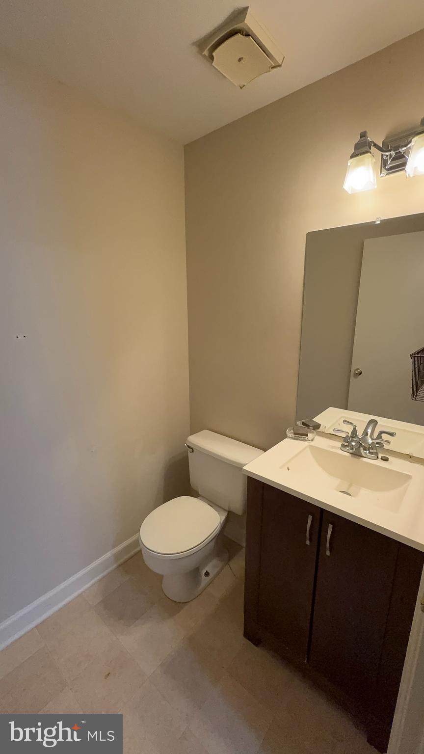 7907 Gambrill Court Springfield, VA 22153 - Photo 34 of 35 a bathroom with a sink a toilet and mirror