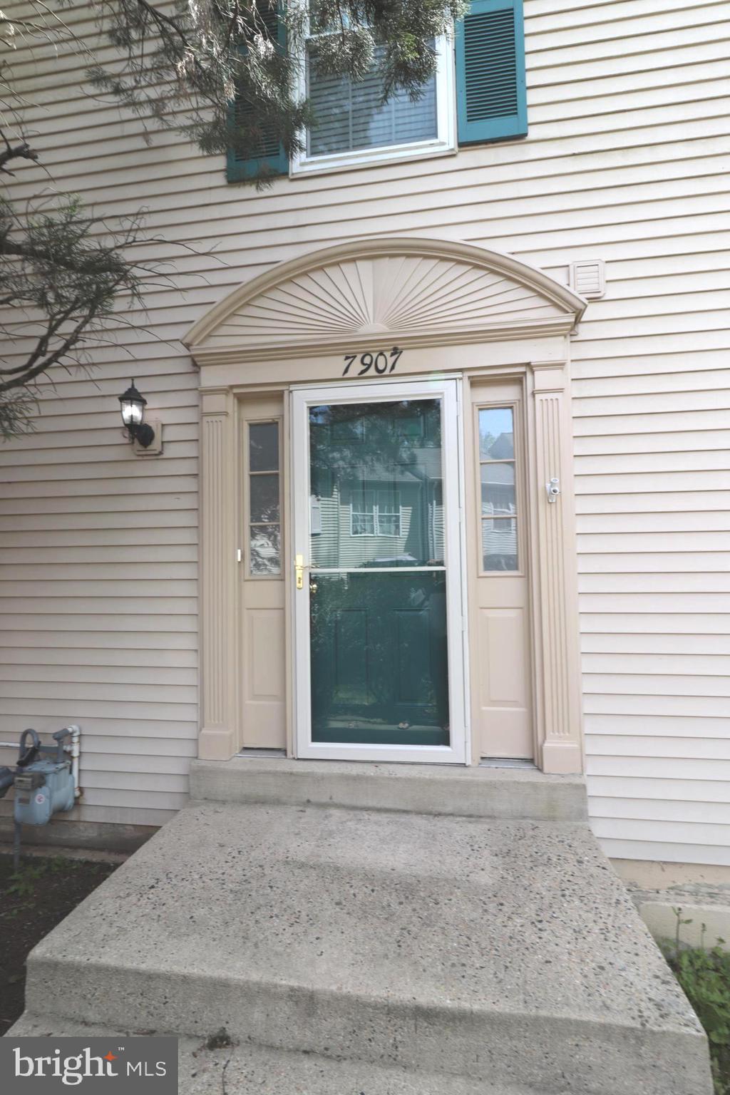 7907 Gambrill Court Springfield, VA 22153 - Photo 4 of 35 a front view of a house with a garage