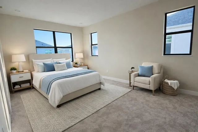 a bedroom with a bed and a couch