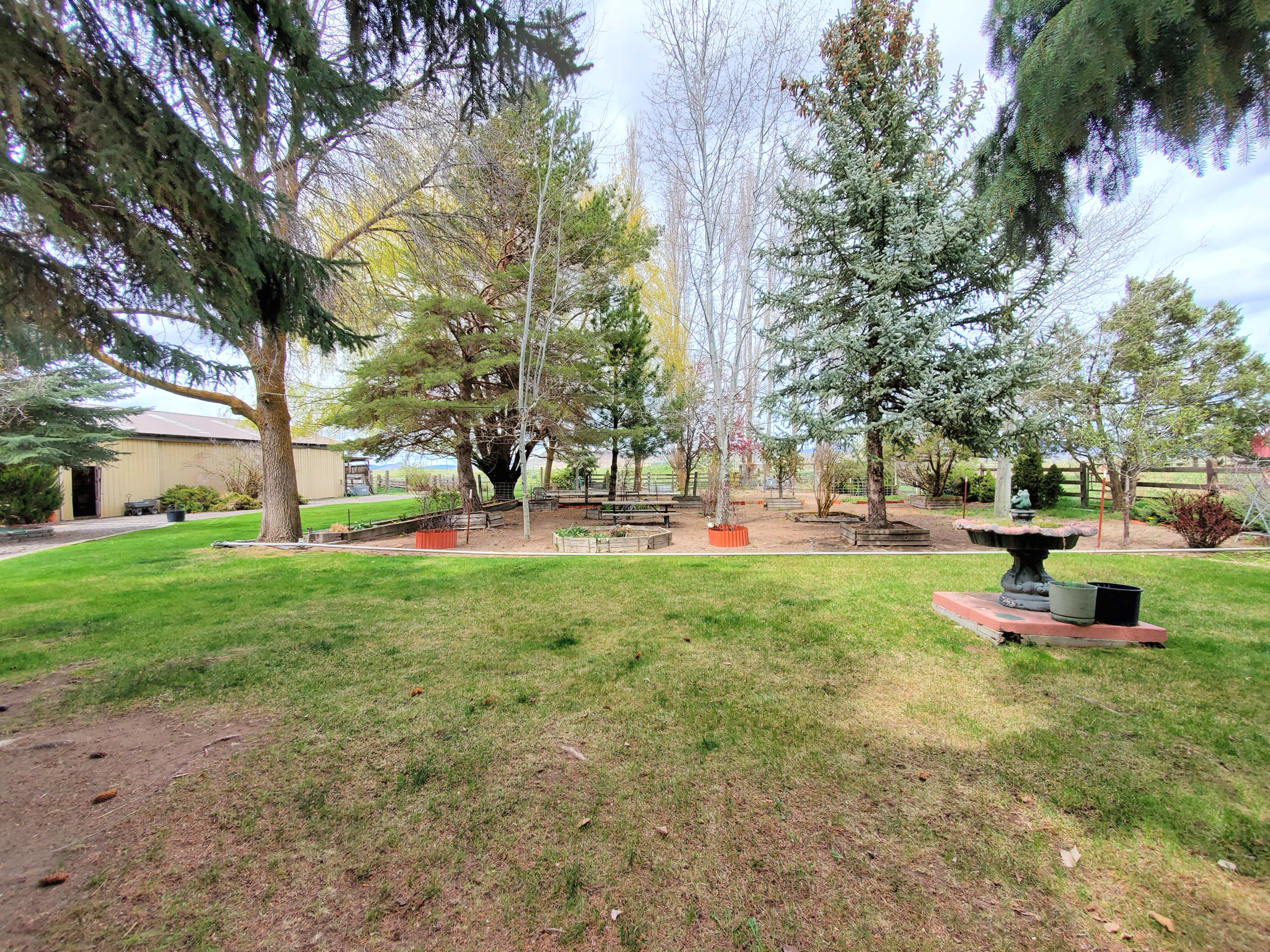 2341 Cross Road Klamath Falls, OR 97603 - Photo 29 of 33 Huge yard and garden space. View from just outside fenced veggie garden area. Yard and flower garden in front, more yard and barn to the left, in the distance on the other side of the fence is pastureland