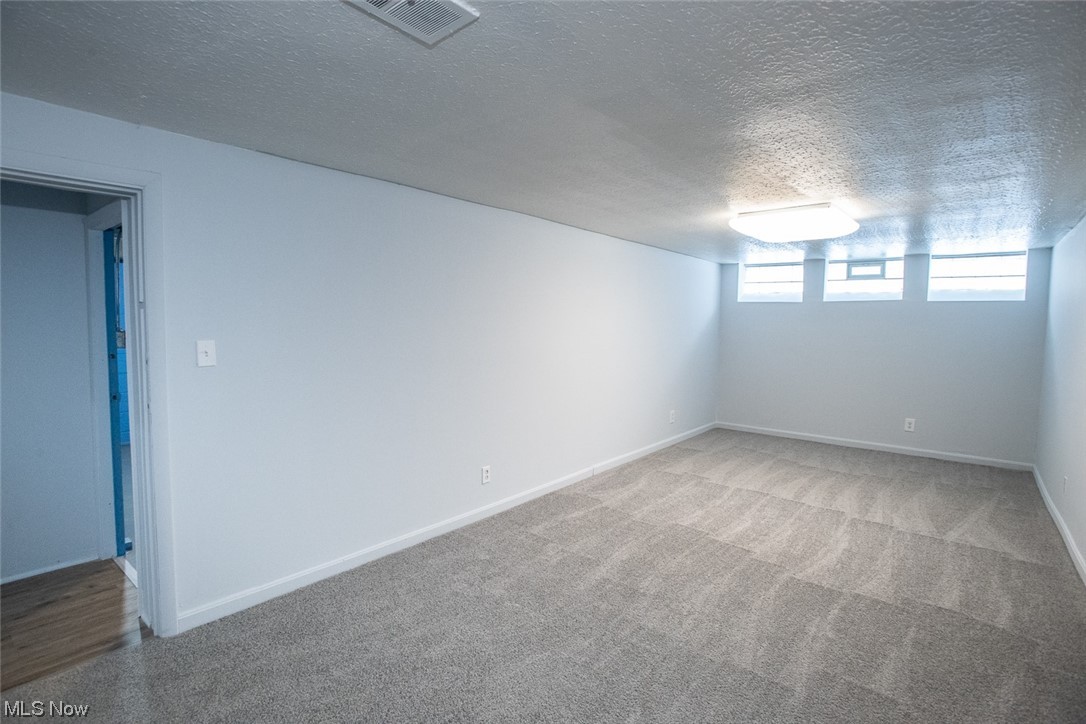 208 Greenvale Road Cleveland, OH 44121 - Photo 28 of 33 Carpeted empty room with a textured ceiling