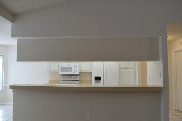 a view of livingroom with furniture window and a ceiling fan