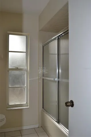 a front view of a house with yard and trees