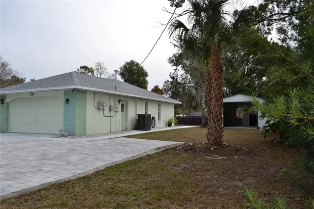 a view of a house with a garage