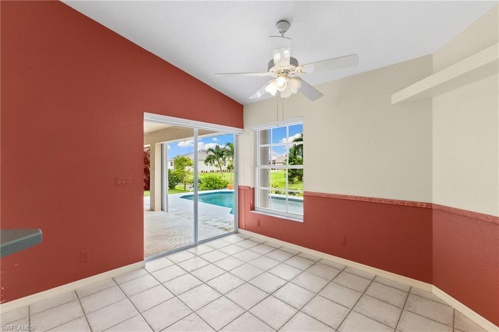 24060 Pyramid Way Punta Gorda, FL 33955 - Photo 17 of 48 Tiled spare room with ceiling fan and vaulted ceiling