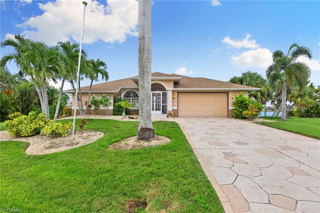 24060 Pyramid Way Punta Gorda, FL 33955 - Photo 2 of 48 Mediterranean / spanish home with a front yard and a garage