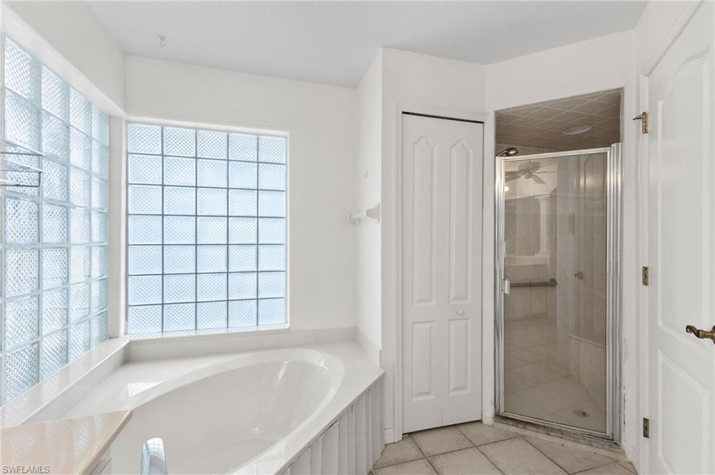 24060 Pyramid Way Punta Gorda, FL 33955 - Photo 22 of 48 Bathroom with tile patterned flooring and separate shower and tub