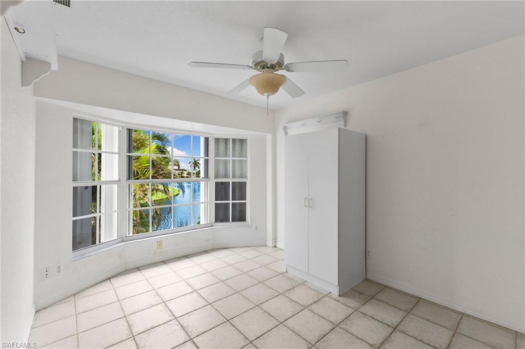 24060 Pyramid Way Punta Gorda, FL 33955 - Photo 25 of 48 Tiled empty room with ceiling fan