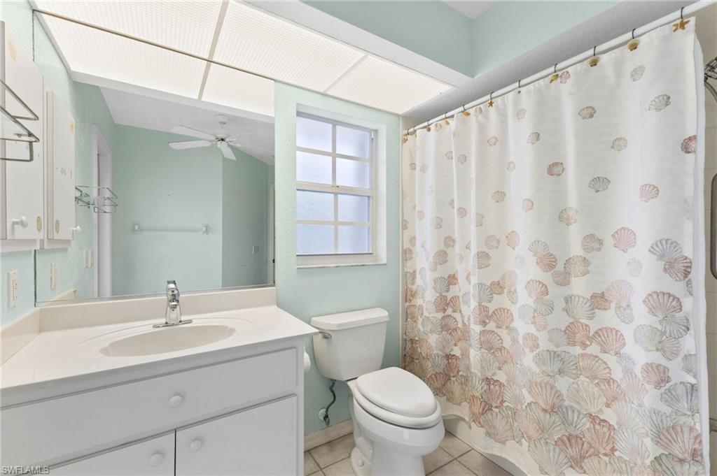 24060 Pyramid Way Punta Gorda, FL 33955 - Photo 26 of 48 Bathroom featuring ceiling fan, vanity, toilet, and tile patterned flooring