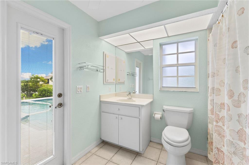 24060 Pyramid Way Punta Gorda, FL 33955 - Photo 27 of 48 Bathroom with toilet, tile patterned floors, and vanity