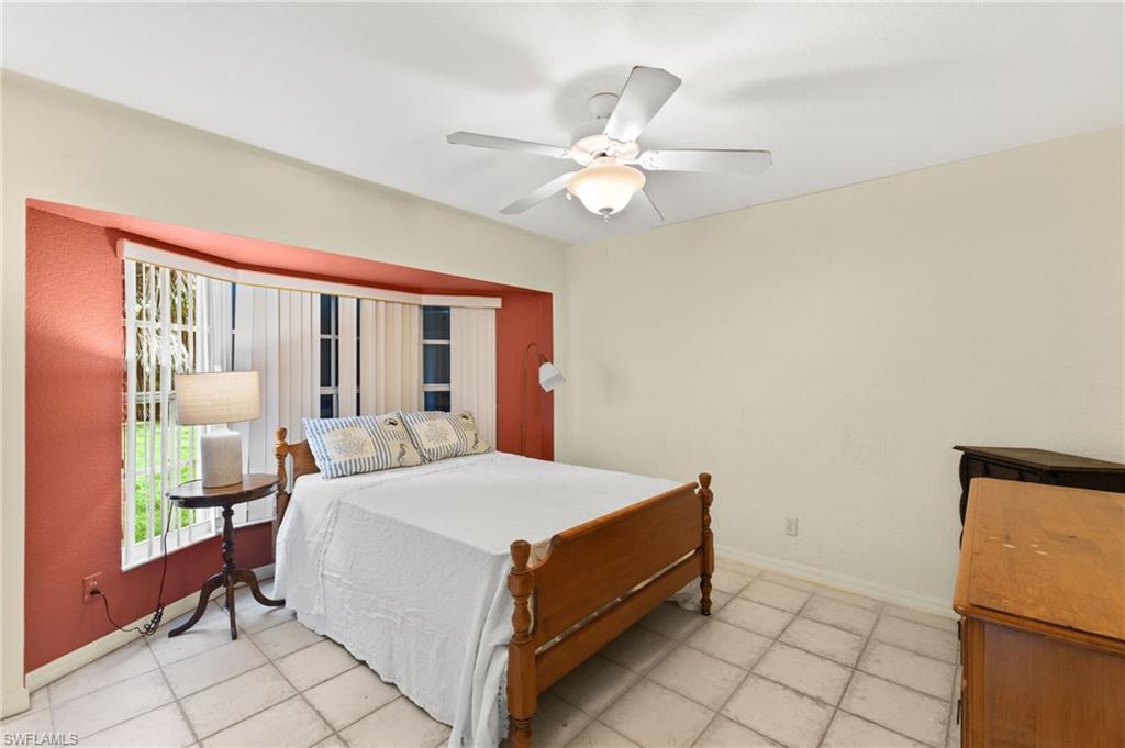 24060 Pyramid Way Punta Gorda, FL 33955 - Photo 28 of 48 Tiled bedroom with ceiling fan