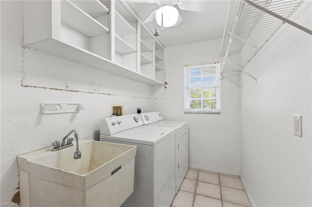 24060 Pyramid Way Punta Gorda, FL 33955 - Photo 29 of 48 Washroom with ceiling fan, sink, washing machine and clothes dryer, and light tile patterned floors