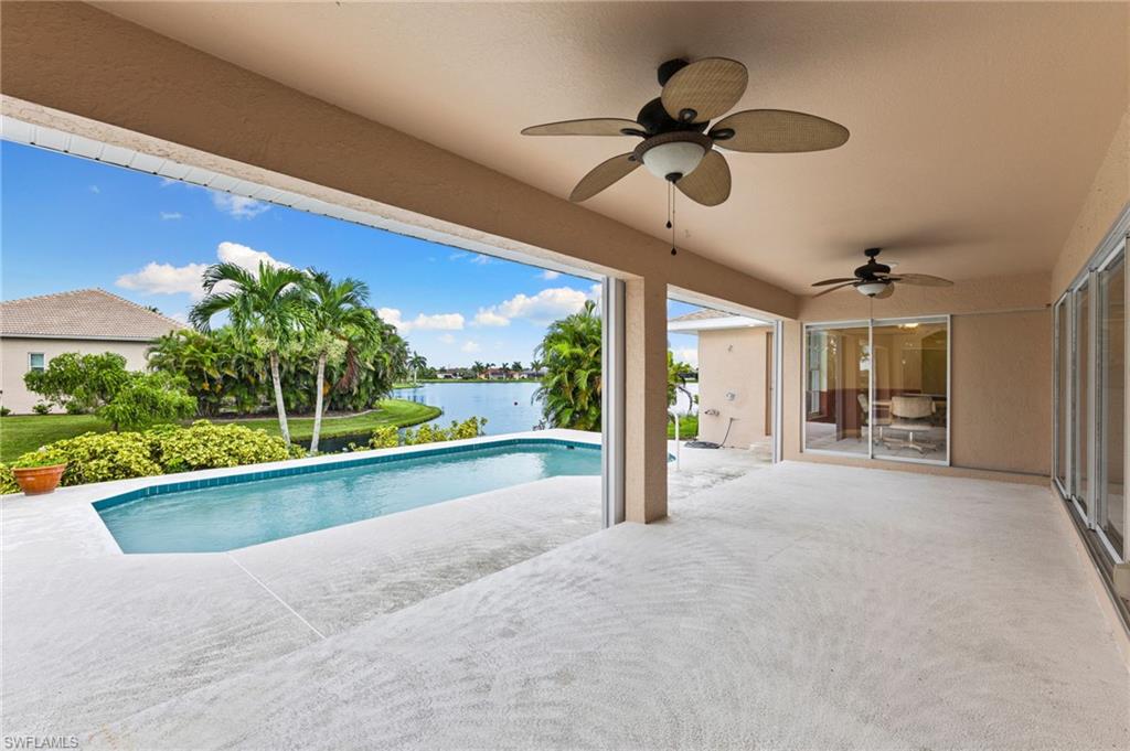 24060 Pyramid Way Punta Gorda, FL 33955 - Photo 35 of 48 View of pool with ceiling fan, a patio, and a water view