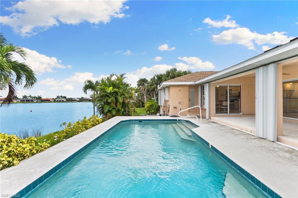 24060 Pyramid Way Punta Gorda, FL 33955 - Photo 36 of 48 View of swimming pool with a patio and a water view