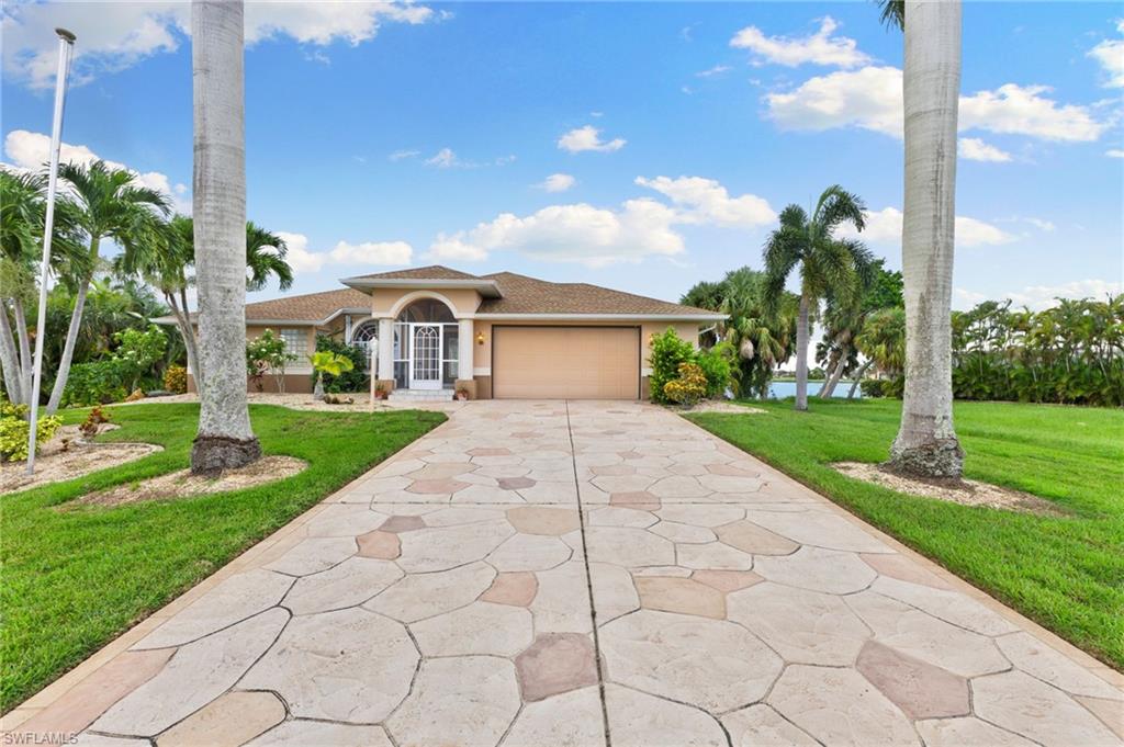 24060 Pyramid Way Punta Gorda, FL 33955 - Photo 42 of 48 Mediterranean / spanish house featuring a garage and a front lawn
