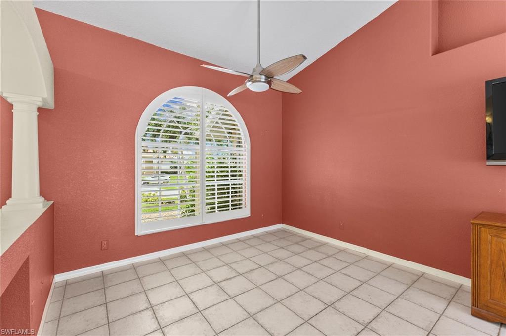 24060 Pyramid Way Punta Gorda, FL 33955 - Photo 7 of 48 Unfurnished dining area featuring ceiling fan, light tile patterned flooring, high vaulted ceiling, and ornate columns