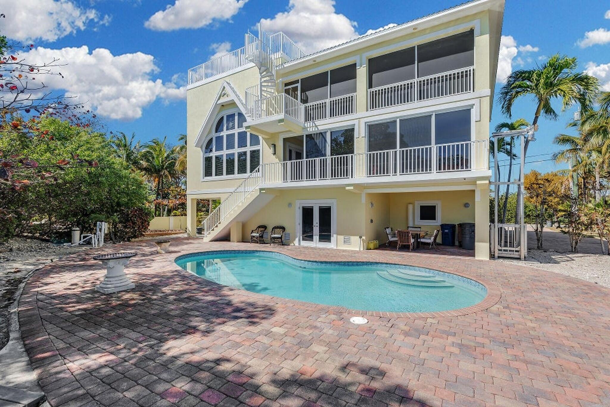 205 Stirrup Key Boulevard Marathon, FL 33050 - Photo 5 of 57 5-REAR VIEW POOL BRICK PAVERS SURROUND