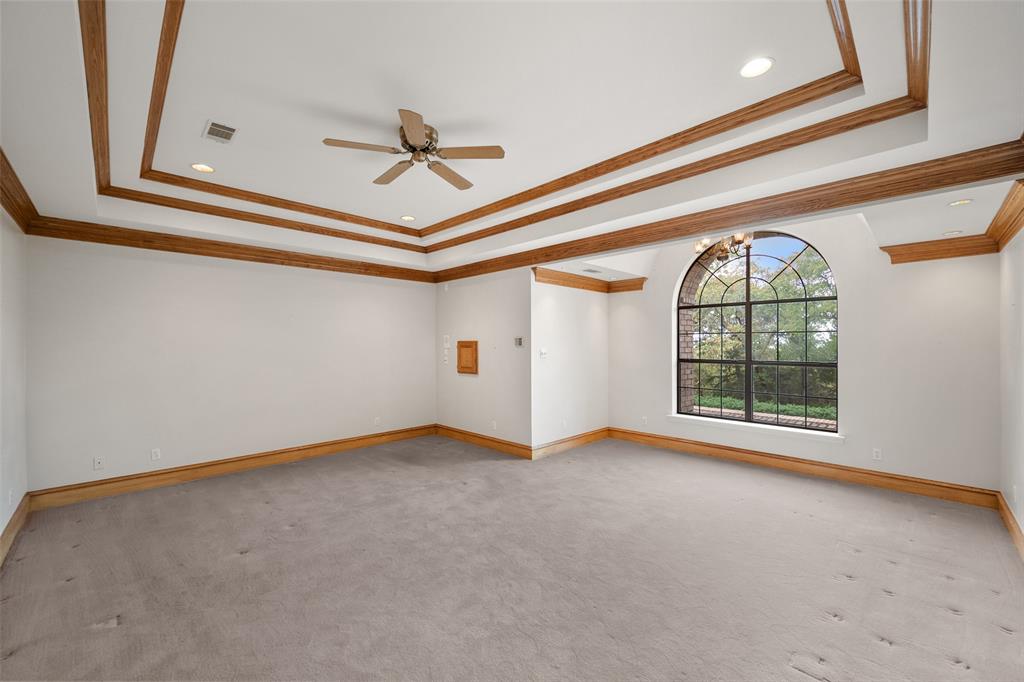 217 Williams Road Fort Worth, TX 76120 - Photo 12 of 36 Large primary bedroom with sitting area has views of the private, sprawling grounds