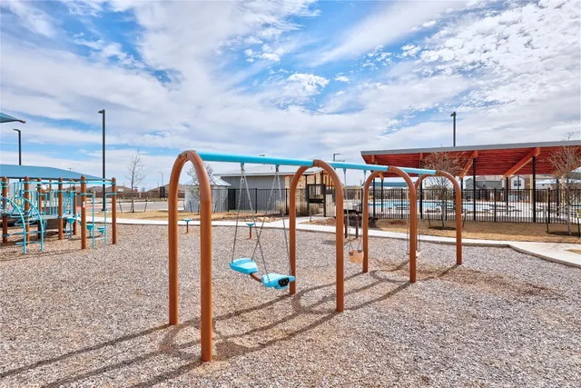 a view of a swimming pool with an outdoor seating