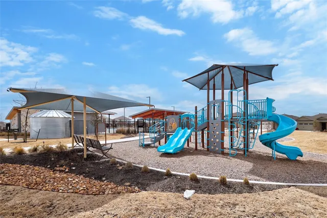 a swimming pool with outdoor seating